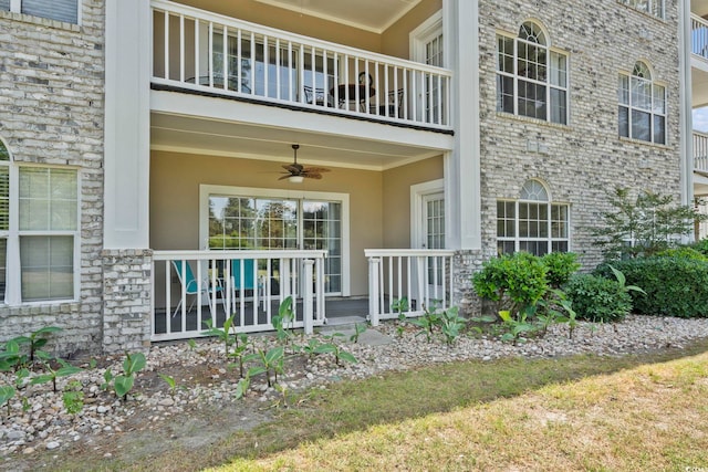 4771 Wild Iris Dr Unit 103, Myrtle Beach, SC 29577 - property entrance with a ceiling fan, a balcony, and stucco siding