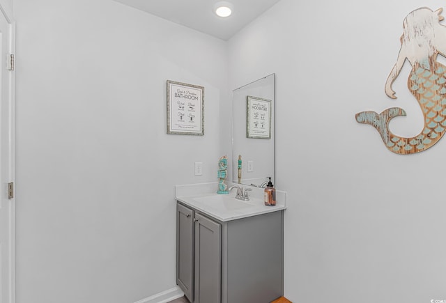 bathroom with baseboards and vanity