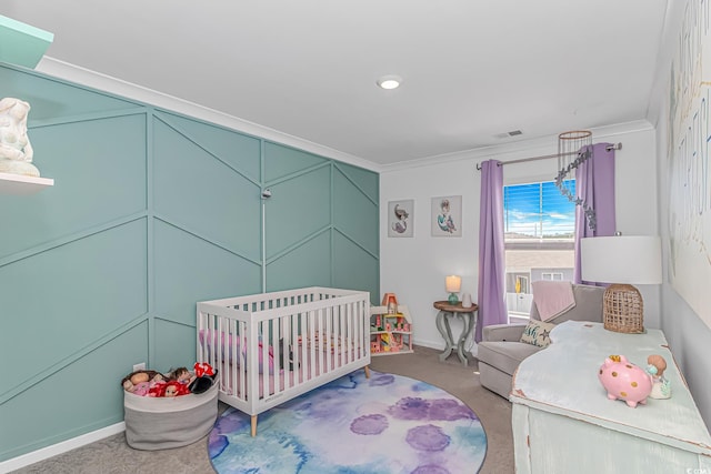 carpeted bedroom with baseboards, ornamental molding, and visible vents