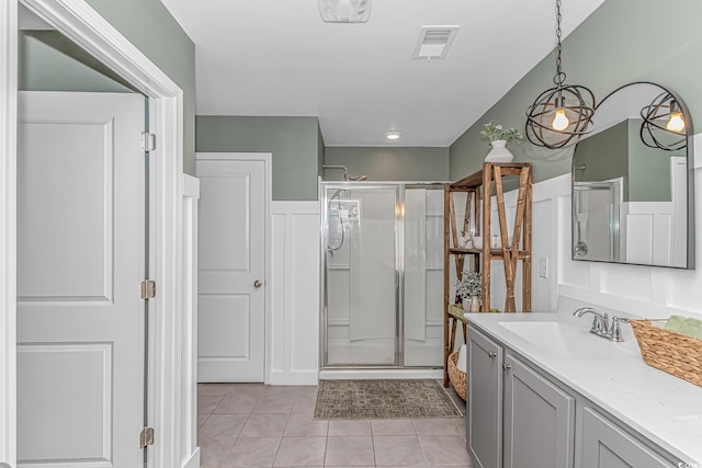 full bath featuring visible vents, a stall shower, tile patterned flooring, and vanity