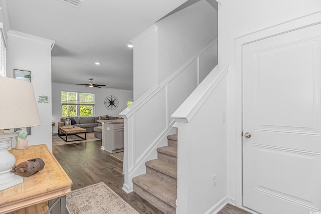 stairway featuring recessed lighting, ceiling fan, and wood finished floors
