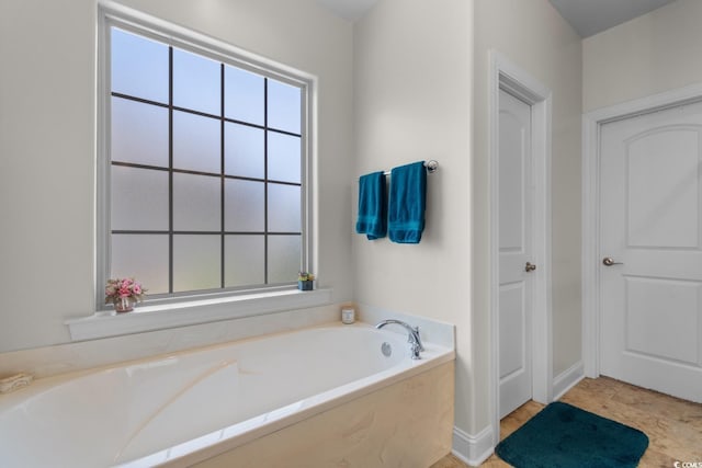 9060 Abingdon Dr, Myrtle Beach, SC 29579 - bathroom with plenty of natural light and a garden tub