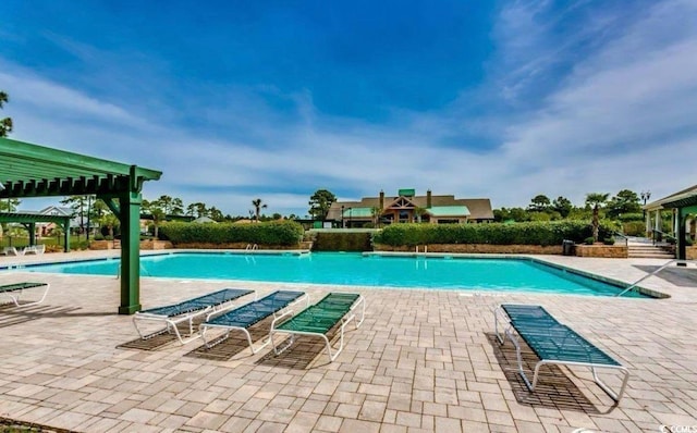 9060 Abingdon Dr, Myrtle Beach, SC 29579 - community pool featuring a pergola and a patio