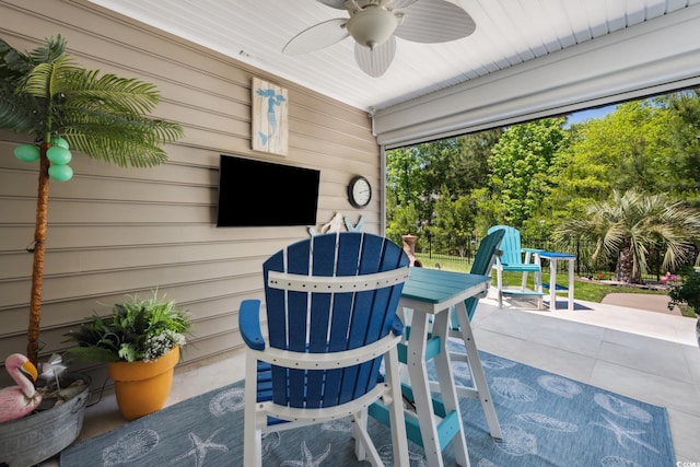 view of patio featuring ceiling fan