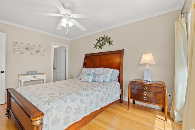 bedroom with baseboards, ornamental molding, light wood-style flooring, and a ceiling fan