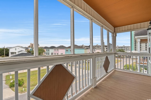unfurnished sunroom with a residential view
