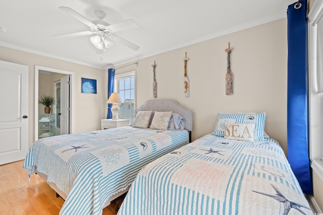 bedroom with crown molding, ceiling fan, and wood finished floors
