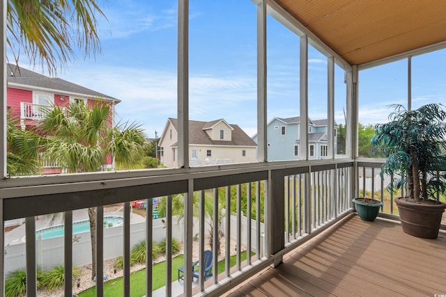 unfurnished sunroom featuring a residential view