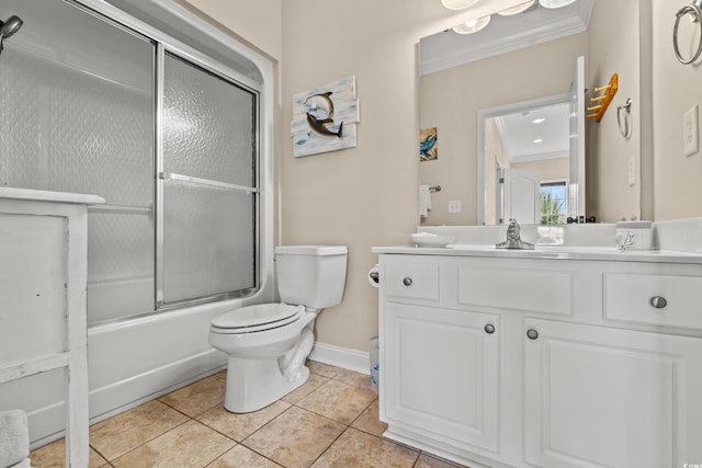 bathroom with crown molding, shower / bath combination with glass door, tile patterned flooring, vanity, and toilet