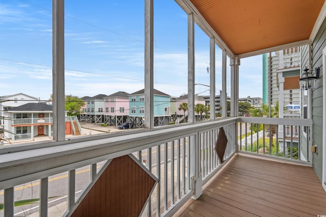 unfurnished sunroom featuring a residential view