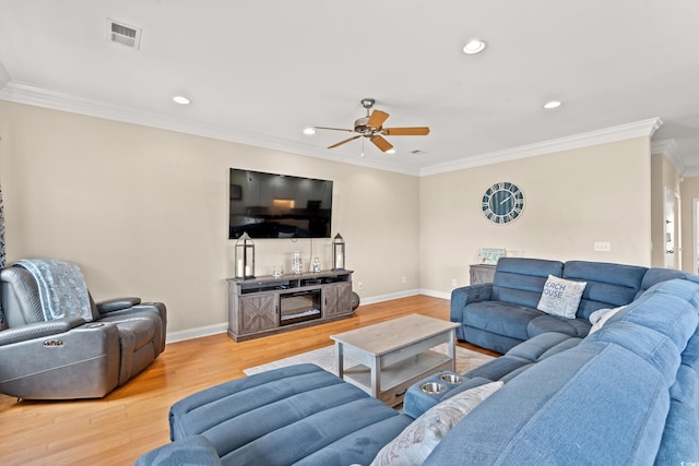 living room featuring a ceiling fan, visible vents, crown molding, wood finished floors, and recessed lighting