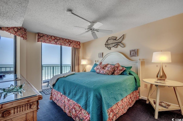 bedroom featuring a textured ceiling, access to outside, a ceiling fan, and carpet floors