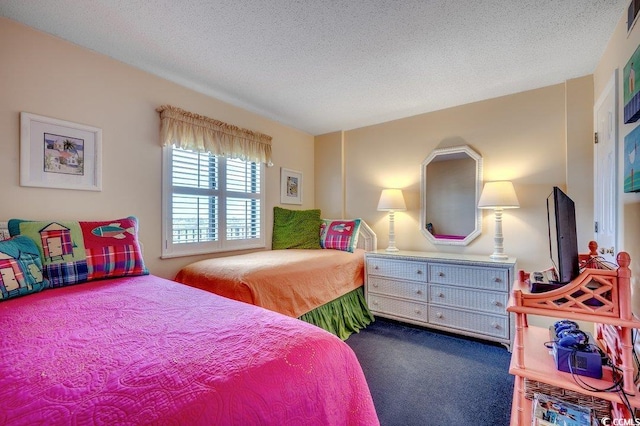 carpeted bedroom with a textured ceiling and visible vents