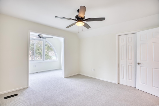 1023 S Sea Bridge Ct, Surfside Beach, SC 29575 - unfurnished bedroom featuring carpet floors, a closet, baseboards, and a ceiling fan