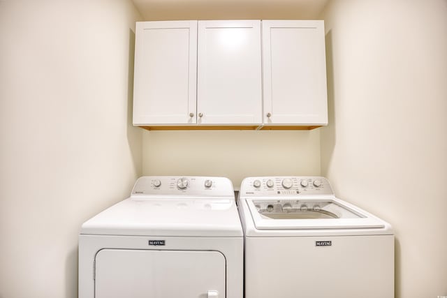 1023 S Sea Bridge Ct, Surfside Beach, SC 29575 - laundry area featuring cabinet space and washing machine and clothes dryer