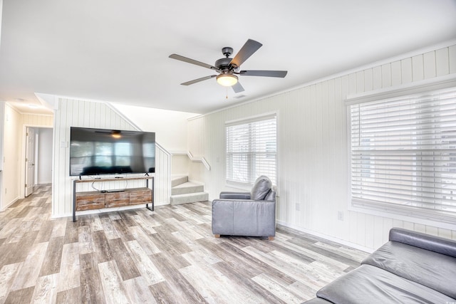 1023 S Sea Bridge Ct, Surfside Beach, SC 29575 - living area with crown molding, stairs, wood finished floors, and ceiling fan