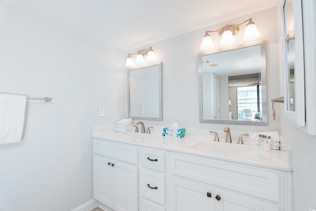 full bath with double vanity and a sink