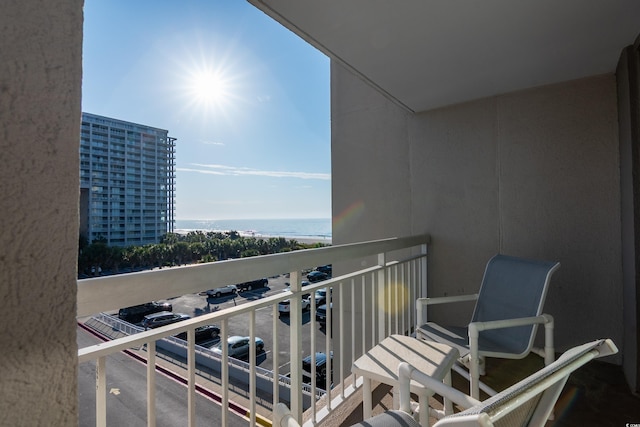 balcony featuring a water view