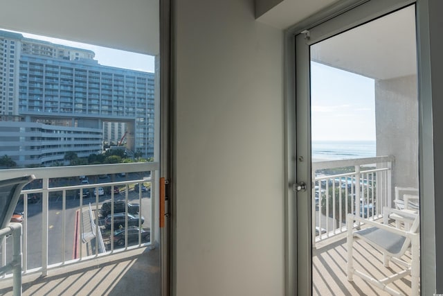 balcony with a view of city and a water view