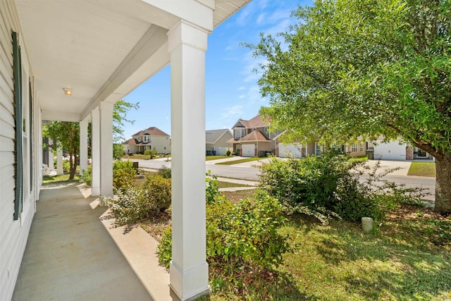 view of patio / terrace with a porch and a residential view