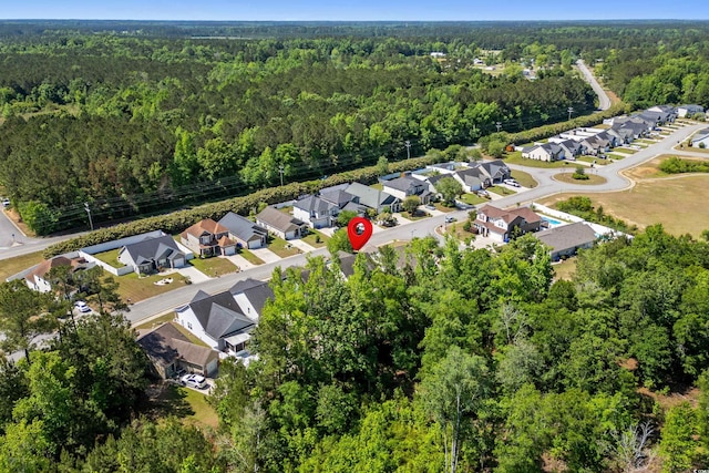 bird's eye view with a view of trees and a residential view