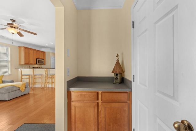 corridor featuring light wood-style flooring and recessed lighting