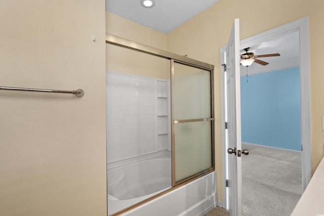 full bath featuring shower / bath combination with glass door, a ceiling fan, and baseboards