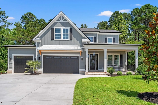209 Bouquets Green Way, Myrtle Beach, SC 29579 - view of front of house with board and batten siding, a porch, a front yard, concrete driveway, and an attached garage