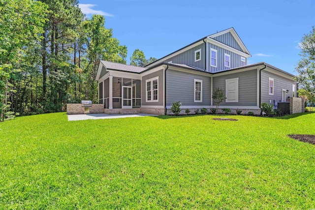 209 Bouquets Green Way, Myrtle Beach, SC 29579 - back of property featuring board and batten siding, a sunroom, a yard, and a patio
