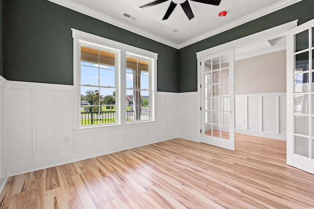 209 Bouquets Green Way, Myrtle Beach, SC 29579 - unfurnished room featuring a decorative wall, a ceiling fan, light wood finished floors, a wainscoted wall, and crown molding