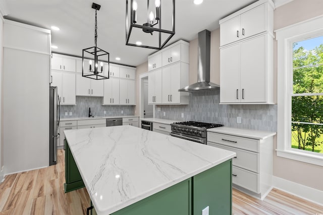 209 Bouquets Green Way, Myrtle Beach, SC 29579 - kitchen with wall chimney range hood, a chandelier, stainless steel appliances, a center island, and white cabinets