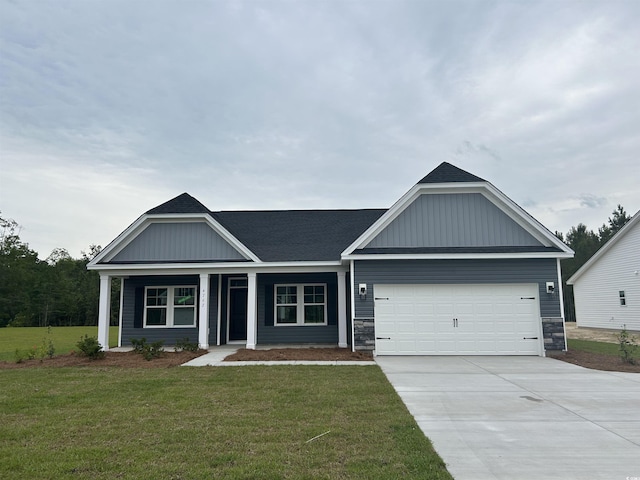 4762 Huckleberry Ln, Conway, SC 29526 - ranch-style house featuring an attached garage, a front lawn, driveway, and board and batten siding
