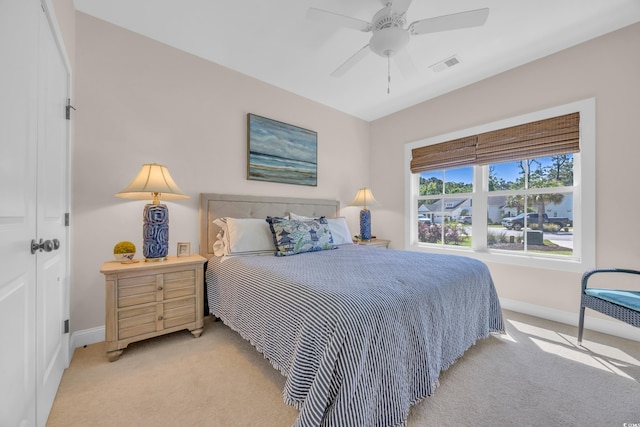 bedroom featuring light carpet, baseboards, and visible vents