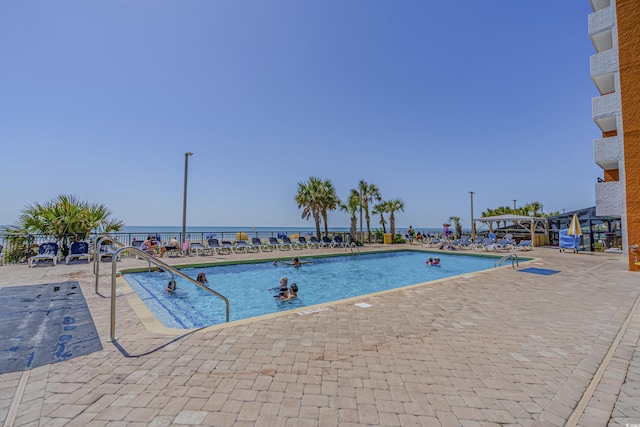 community pool with a patio area