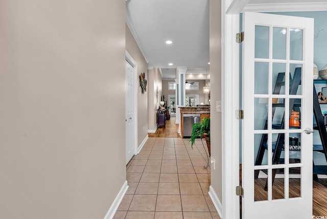 hall with recessed lighting, baseboards, and light tile patterned floors