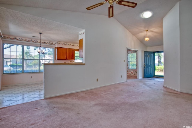 802 Mockingbird Ct, Murrells Inlet, SC 29576 - unfurnished living room with light carpet, a textured ceiling, high vaulted ceiling, ceiling fan with notable chandelier, and baseboards