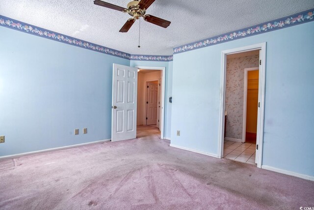 802 Mockingbird Ct, Murrells Inlet, SC 29576 - unfurnished bedroom featuring ceiling fan, a textured ceiling, baseboards, ensuite bathroom, and carpet flooring