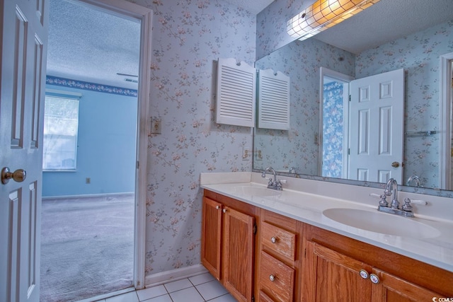 802 Mockingbird Ct, Murrells Inlet, SC 29576 - bathroom featuring double vanity, a sink, a textured ceiling, and tile patterned floors