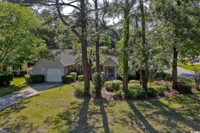 802 Mockingbird Ct, Murrells Inlet, SC 29576 - view of front of house with an attached garage, concrete driveway, and a front lawn