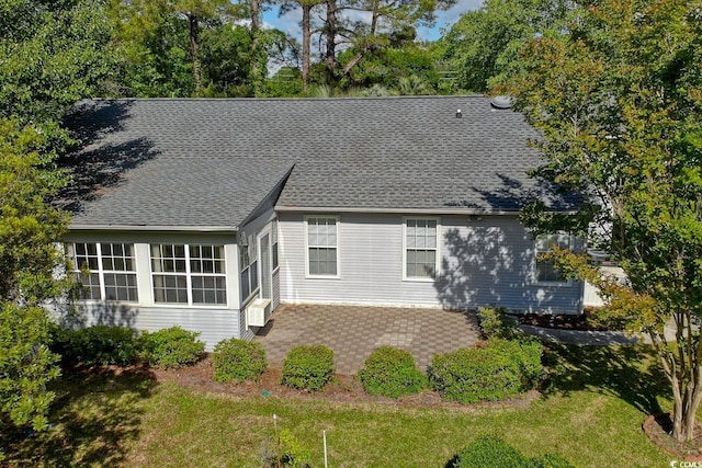 802 Mockingbird Ct, Murrells Inlet, SC 29576 - back of property with a patio area, roof with shingles, and a yard