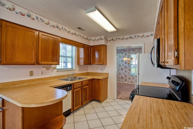 802 Mockingbird Ct, Murrells Inlet, SC 29576 - kitchen featuring stainless steel microwave, white dishwasher, wallpapered walls, and a sink