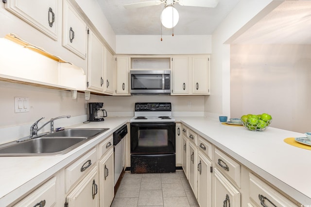 kitchen with light countertops, a sink, a ceiling fan, and stainless steel appliances