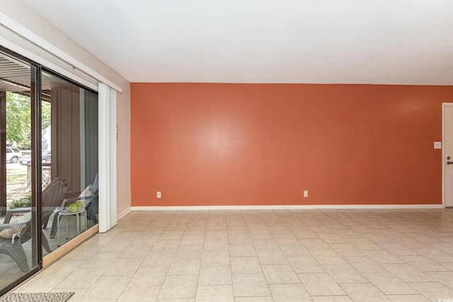 empty room featuring baseboards