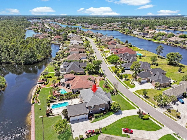 bird's eye view with a residential view and a water view