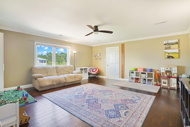 rec room featuring crown molding, dark wood-type flooring, and ceiling fan