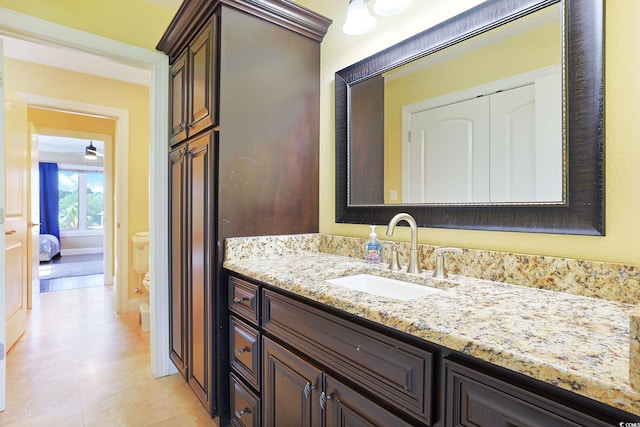 bathroom with toilet and vanity
