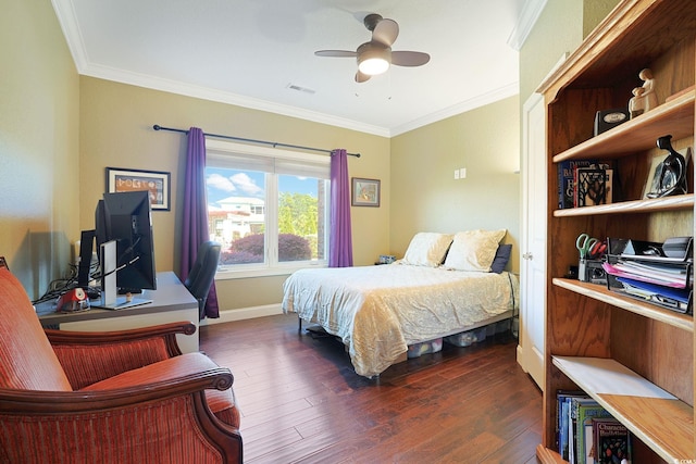 bedroom featuring crown molding, baseboards, dark wood-type flooring, and visible vents