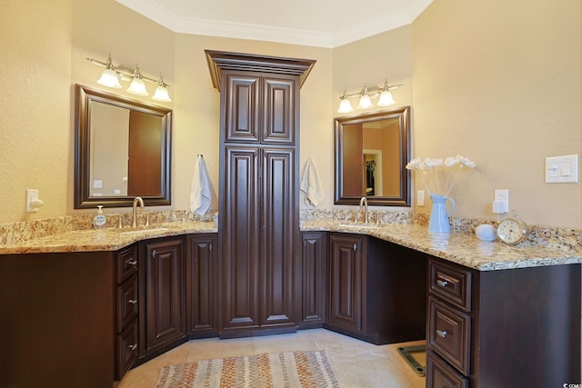 bathroom featuring tile patterned floors, ornamental molding, and vanity
