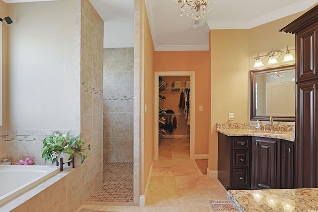 bathroom with a walk in closet, crown molding, walk in shower, vanity, and tile patterned floors