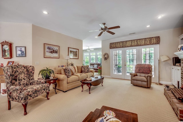 living room with carpet floors, recessed lighting, ceiling fan, and visible vents